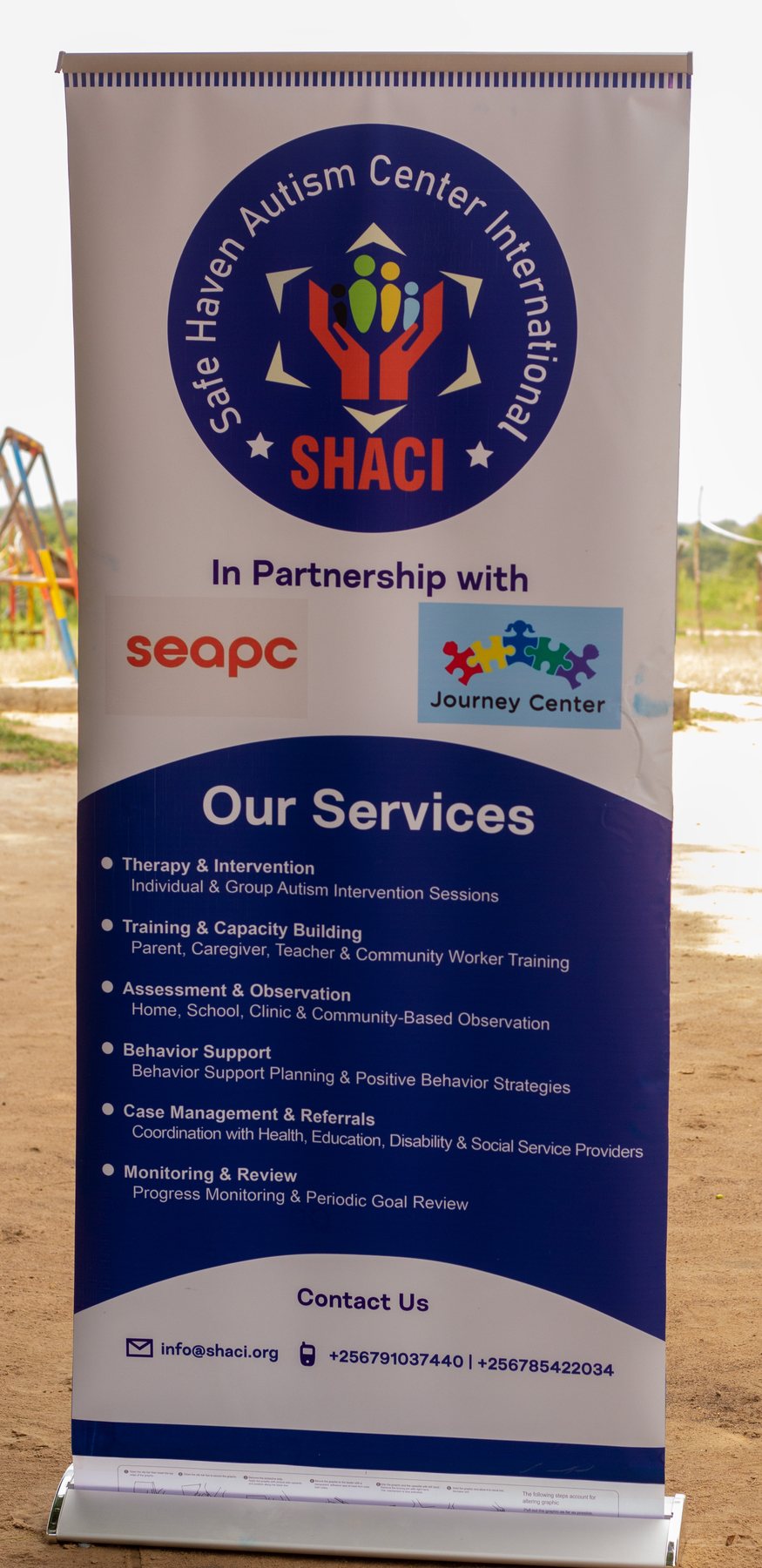 SHACI banner listing services and how to get in touch: info@shaci.org and the Uganda phone numbers