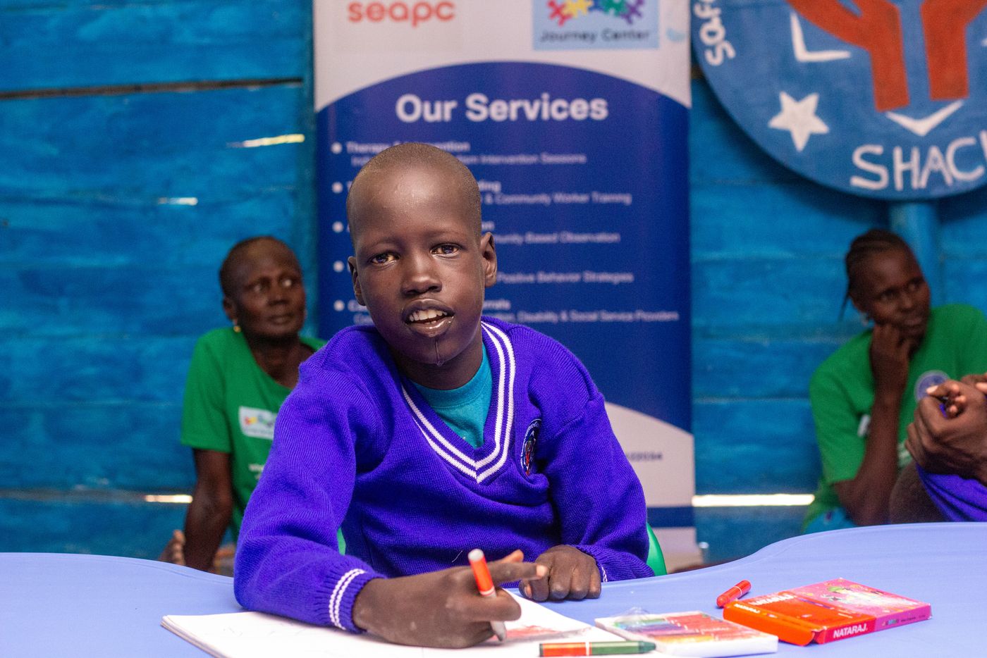 SHACI therapist working with a child on communication skills